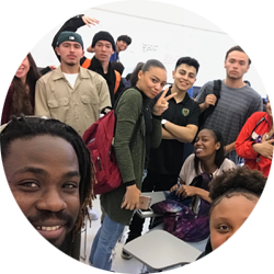 Group of students gesturing peace sign